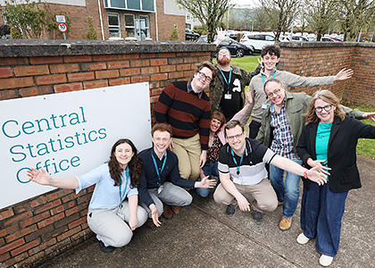 A Group of CSO employees standing by the CSO sign