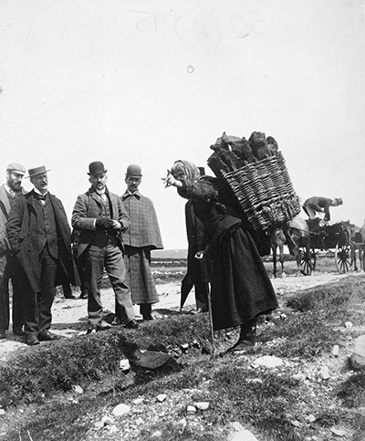 Members of the Congested Districts Board receiving directions from a local woman