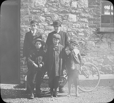 Mitchers, 4 young boys with school attendance officer and bicycle, 1910